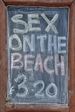Blackboard with the name and price of the cocktail 'Sex on the Beach'