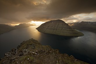Dramatic mood lighting over the islands of Kalsoy