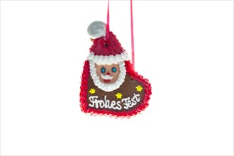 Gingerbread heart with Santa Claus and the writing 'Frohes Fest'