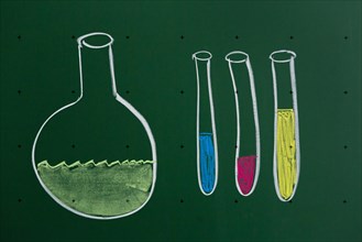 Laboratory flask and test tubes drawn with chalk on a blackboard