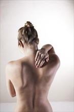 Bare back of a young woman