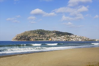 Keykobat beach with the hill of Alanya Castle and the town of Alanya