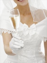 Bride holding a glass of champagne