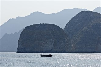 Khor Ash Sham Fjord with a fishing boat