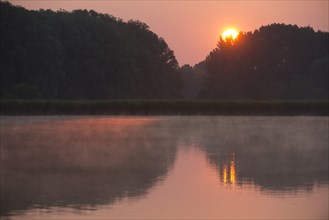 Sunrise over a pond landscape
