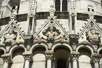 Medieval sculptures on the facade of the Bapistry of Pisa