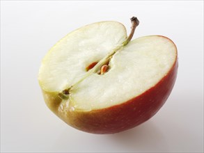 One half of a cut Braeburn apple