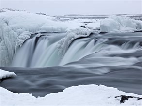 Godafoss waterfall with ice formations