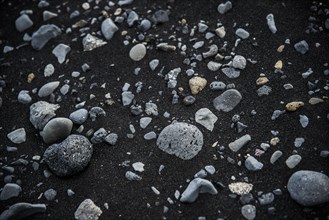 Basalt stones in black lava sand