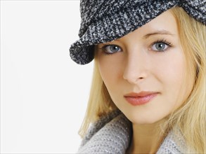 Young woman wearing a gray cap