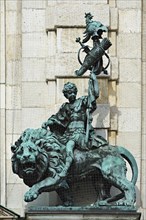 Sculpture of a young man riding a lion