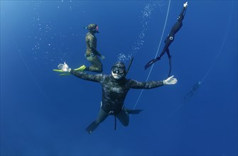Freedivers posing under water