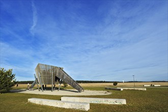 Concrete benches and a slide on a playground