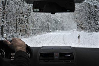 View through the windscreen during snowfall