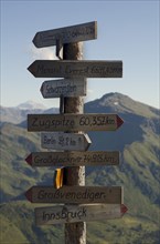 Signpost on Kellerjoch Mountain in front of the Tux Alps
