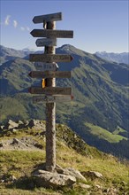 Signpost on Kellerjoch Mountain in front of the Tux Alps