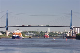 Container ship passing under Koehlbrand Bridge