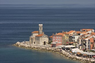 Lighthouse at the harbour entrance of Piran