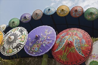 Brightly painted Asian sun umbrellas made of paper