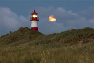 List Ost lighthouse at dusk with the full moon