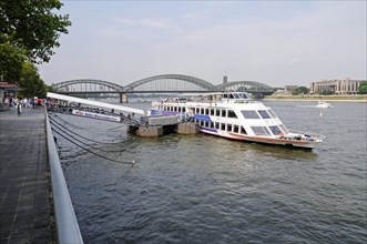 Tour boat at a dock on the bank of the Rhine River