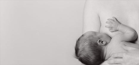 Woman breastfeeding a boy