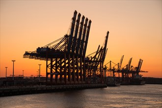 EUROGATE container terminal in the Port of Hamburg at sunset