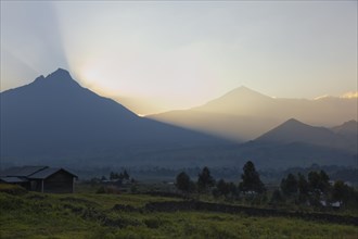 The Virunga volcanoes Mount Mikeno and Mount Karisimbi at sunrise