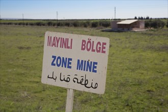 A sign warning of land mines on the Syrian-Turkish border