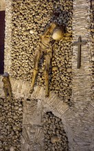 Stacked bones and skulls in the ossuary