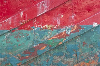 Boat hull with coloured paint residues