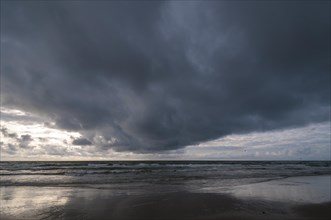 Dramatic cloud formation over a North Sea beach