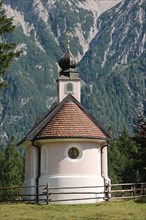 Chapel of Mary Queen in front of the Karwendel Mountains