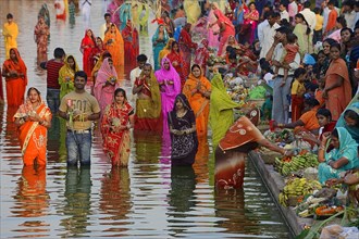 Hindus standing in water during the Hindu Chhath Festival