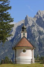 Chapel of Mary Queen in front of the Karwendel Mountains