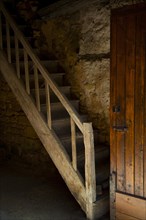 Old door and stairs in Belves