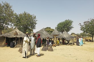 Men wearing traditional Muslim clothing at the market