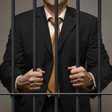 Jailed business man behind prison bars