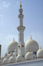 The white marble domes and minaret of Sheikh Zayed Grand Mosque
