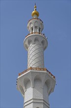 One of the four white marble minarets of Sheikh Zayed Grand Mosque