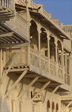 The white wooden merchant houses with their typical balconies