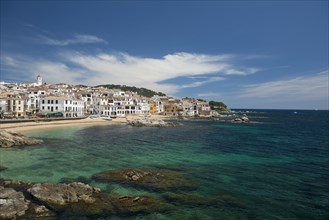 Village with white houses by the sea