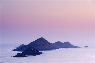 Les Iles Sanguinaires in the mediterranean sea at the blue hour after sunset seen from Tour de la Parata. Les Iles Sanguinaires are in the department Corse-du-Sud
