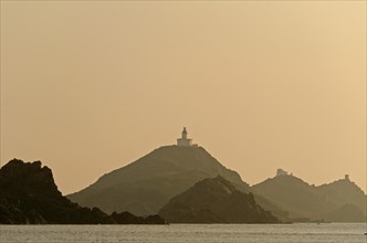 The silhouette of the islands Les Iles Sanguinaires with the lighthouse and a tower. Les Iles Sanguinaires are in the department Corse-du-Sud