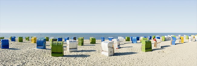 Colourful roofed wicker beach chairs