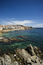 Village with a sandy beach on the sea