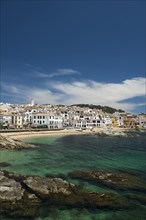 Village with white houses by the sea