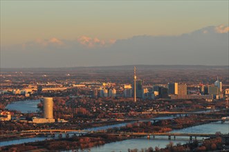 The city of Vienna and the New Danube river at dusk