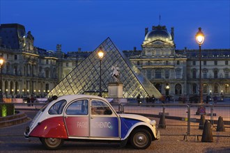 Citroen 2 CV parked front of the Musee du Louvre
