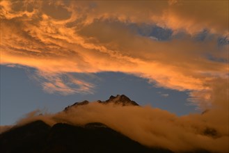 Illuminated clouds above Brandjochspitze mountain